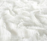 White ruffles on tulle with dots