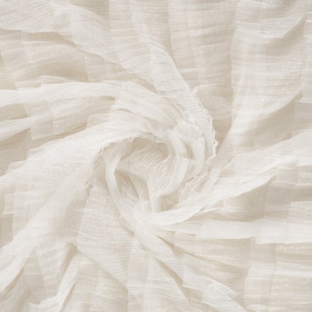 White ruffles on tulle with dots