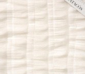 White ruffles on tulle with dots