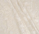 White embroidered flower on tu
