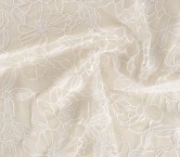 White embroidered flower on tu