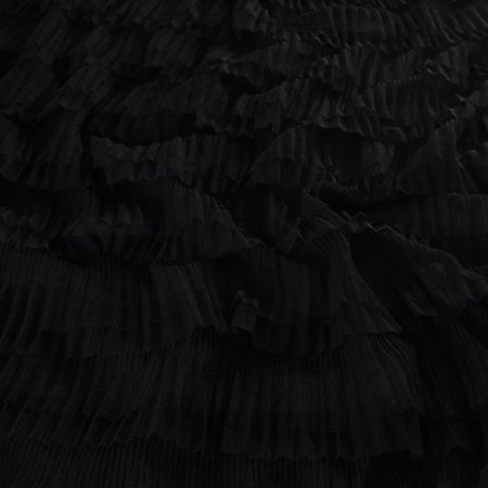 Black ruffles in tulle with dots